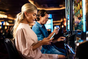 FOOTBALL BET Games — Discover modern slots and table adventures A man celebrating a winning moment on his laptop while gaming symbols float around him, capturing the excitement of FOOTBALL BET games.