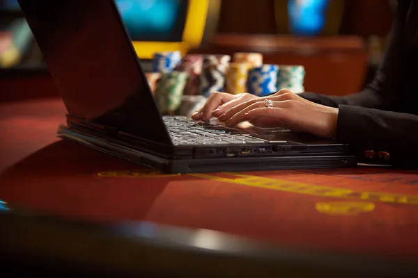 FOOTBALL BET Live Games — Take part in high-energy casino action A glowing roulette wheel with cascading chips, symbolizing the engaging live and instant-win games available on FOOTBALL BET.